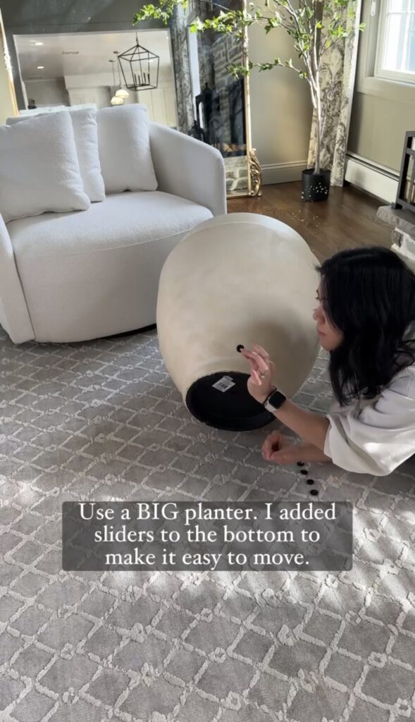 Large planter with adhesive sliders attached to the bottom.