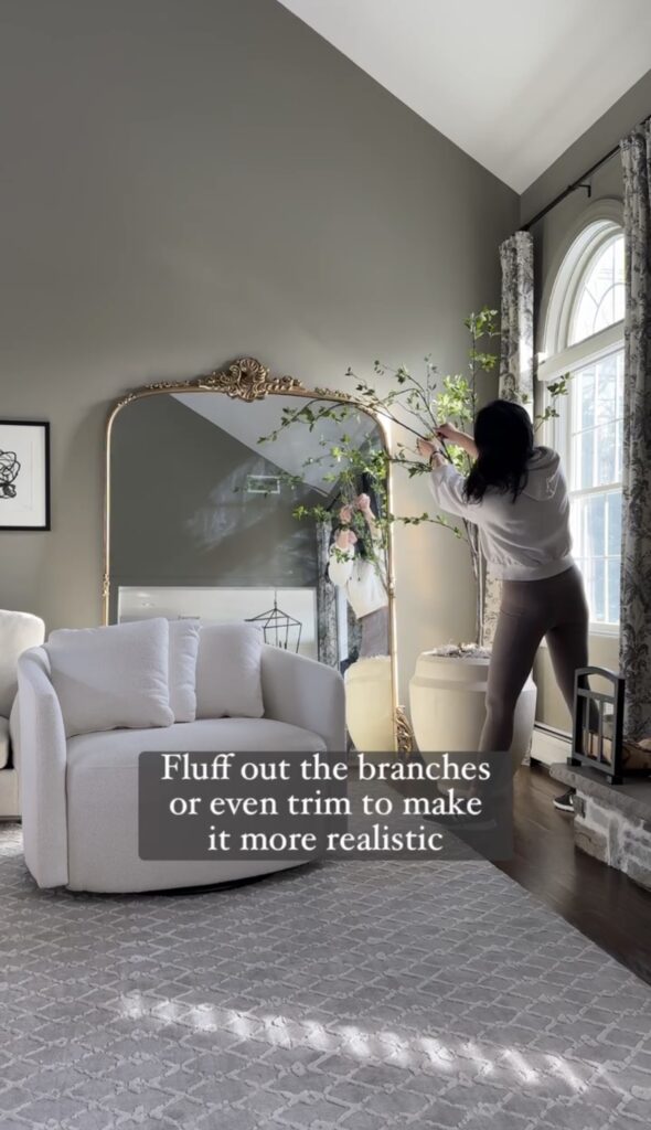 Fluffing branches to shape the faux tree.