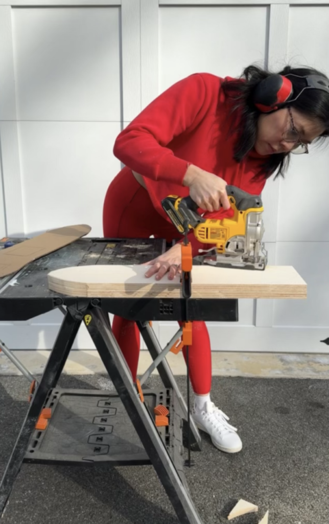 Plywood being cut using jigsaw. 