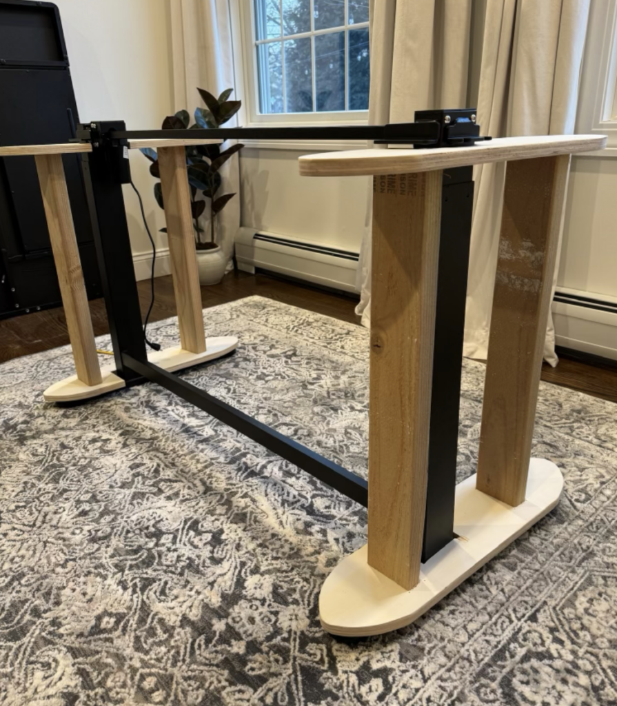 Completed wood base attached to standing desk. 