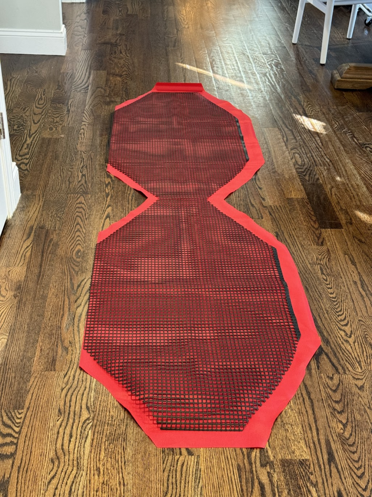 DIY giant bow: laying out the mesh on the fabric