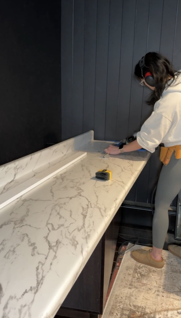 Faux marble countertop being cut to size.